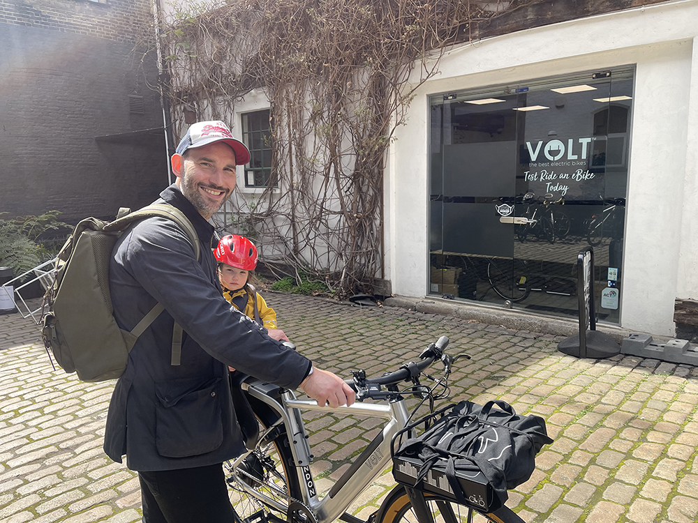 Dad with son in front of Volt Electric Bikes HQ with his new London E-bike